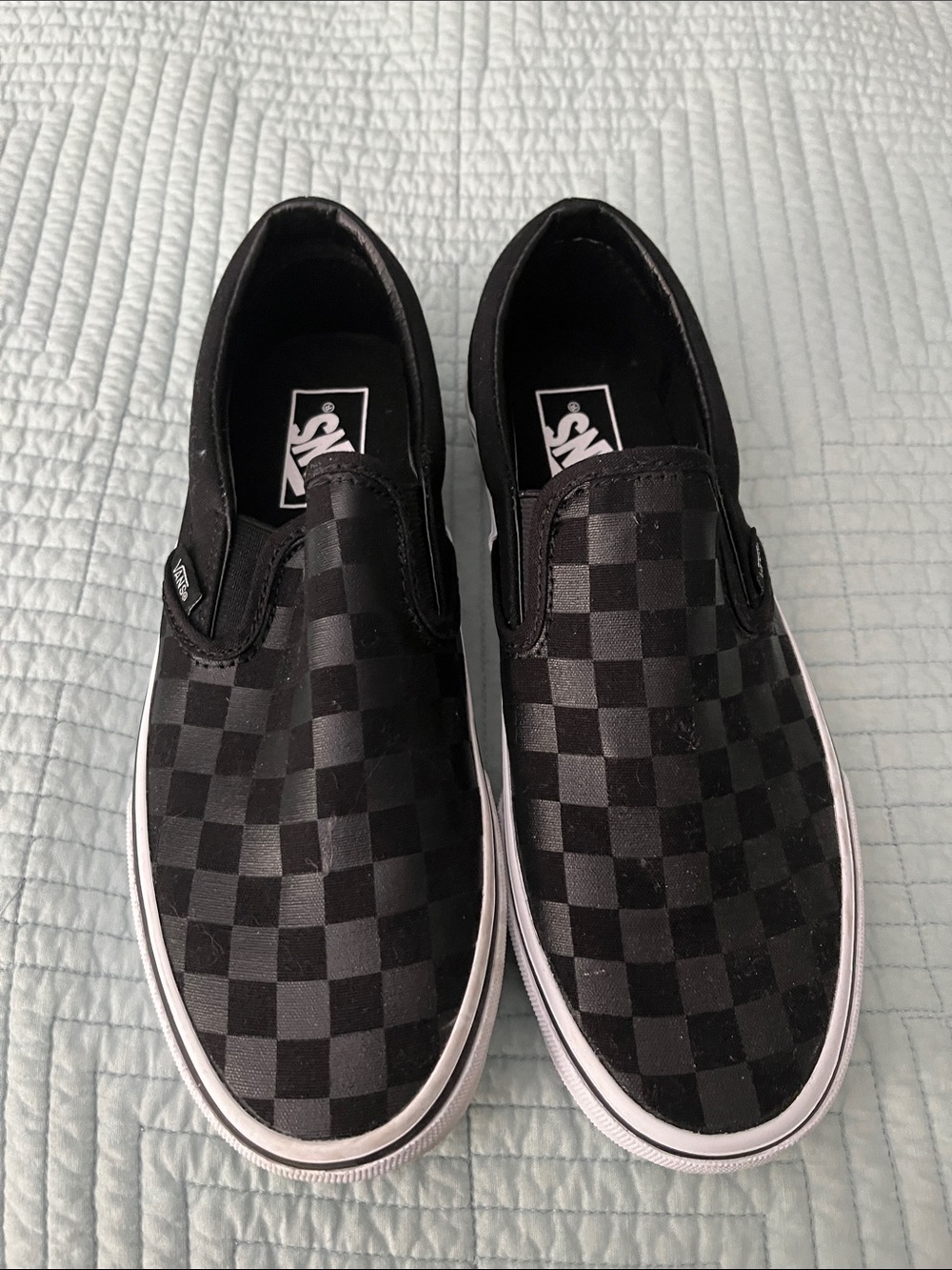 Vans black checkerboard classic slip on